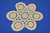 Crochet lace doily in white art nouveau flower