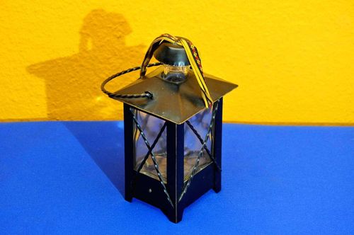 Bottle with music box Metal frame in shape of a lantern