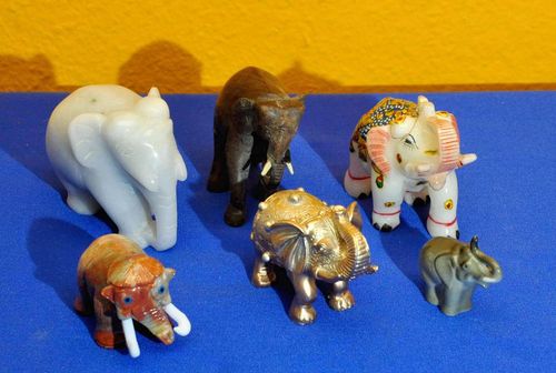 Collection of elephants made of stone porcelain wood