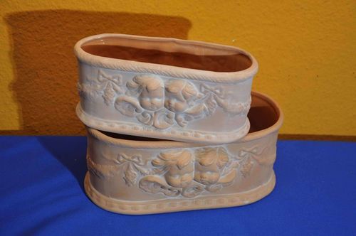 2 terracotta plant bowls with putti inside glaze